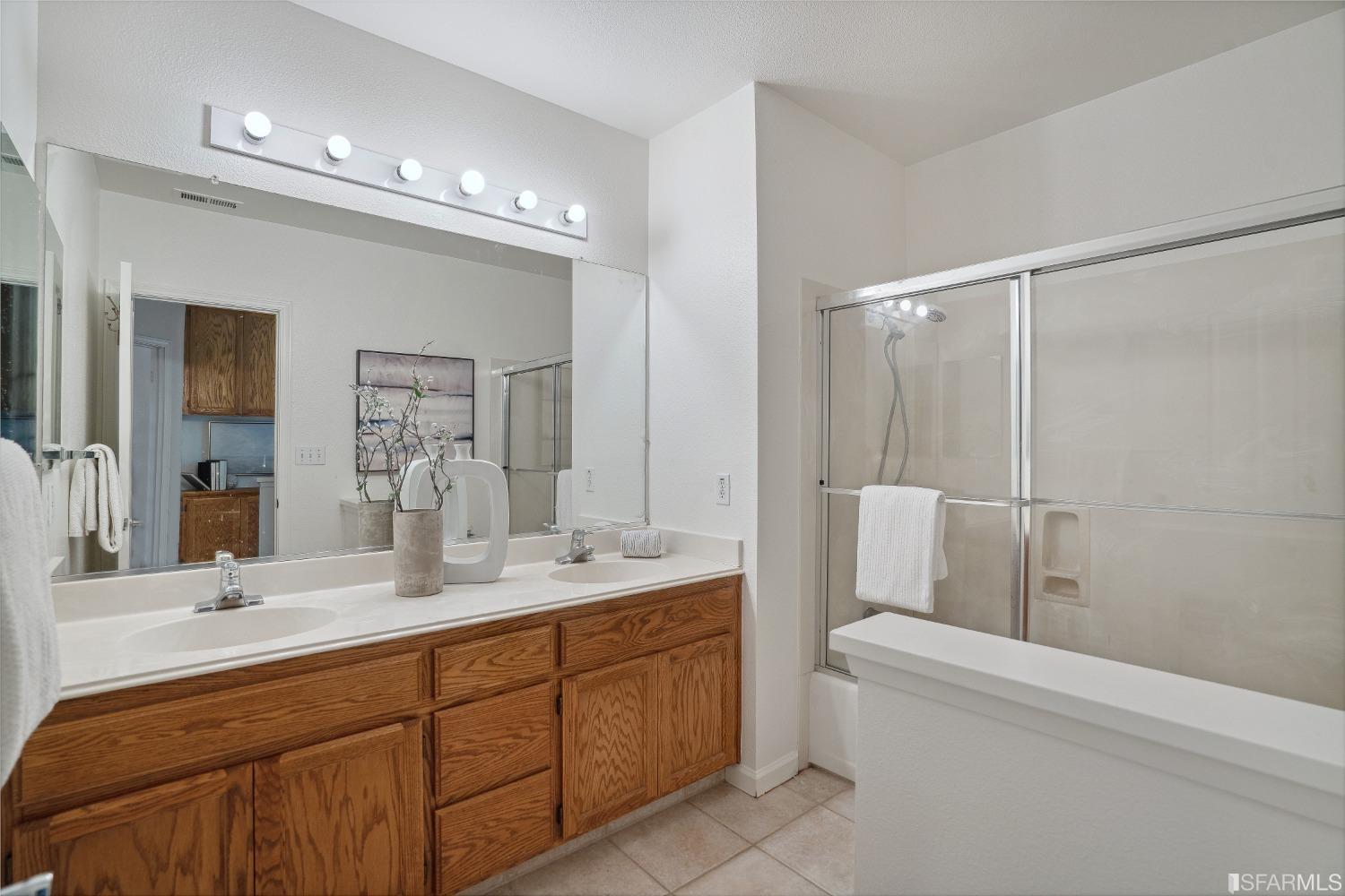 7531 Imperata Lane San Ramon, CA 94582 - Photo 24 of 37 a bathroom with a double vanity sink toilet and shower