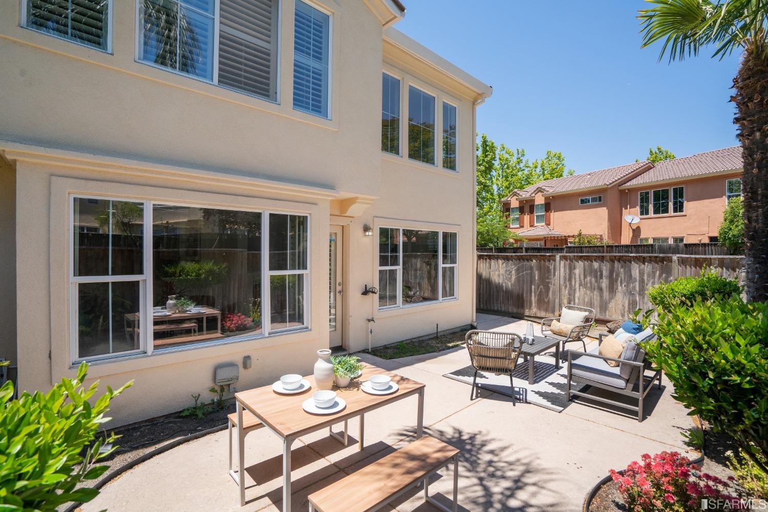 7531 Imperata Lane San Ramon, CA 94582 - Photo 29 of 37 a view of a patio with couches table and chairs and potted plants