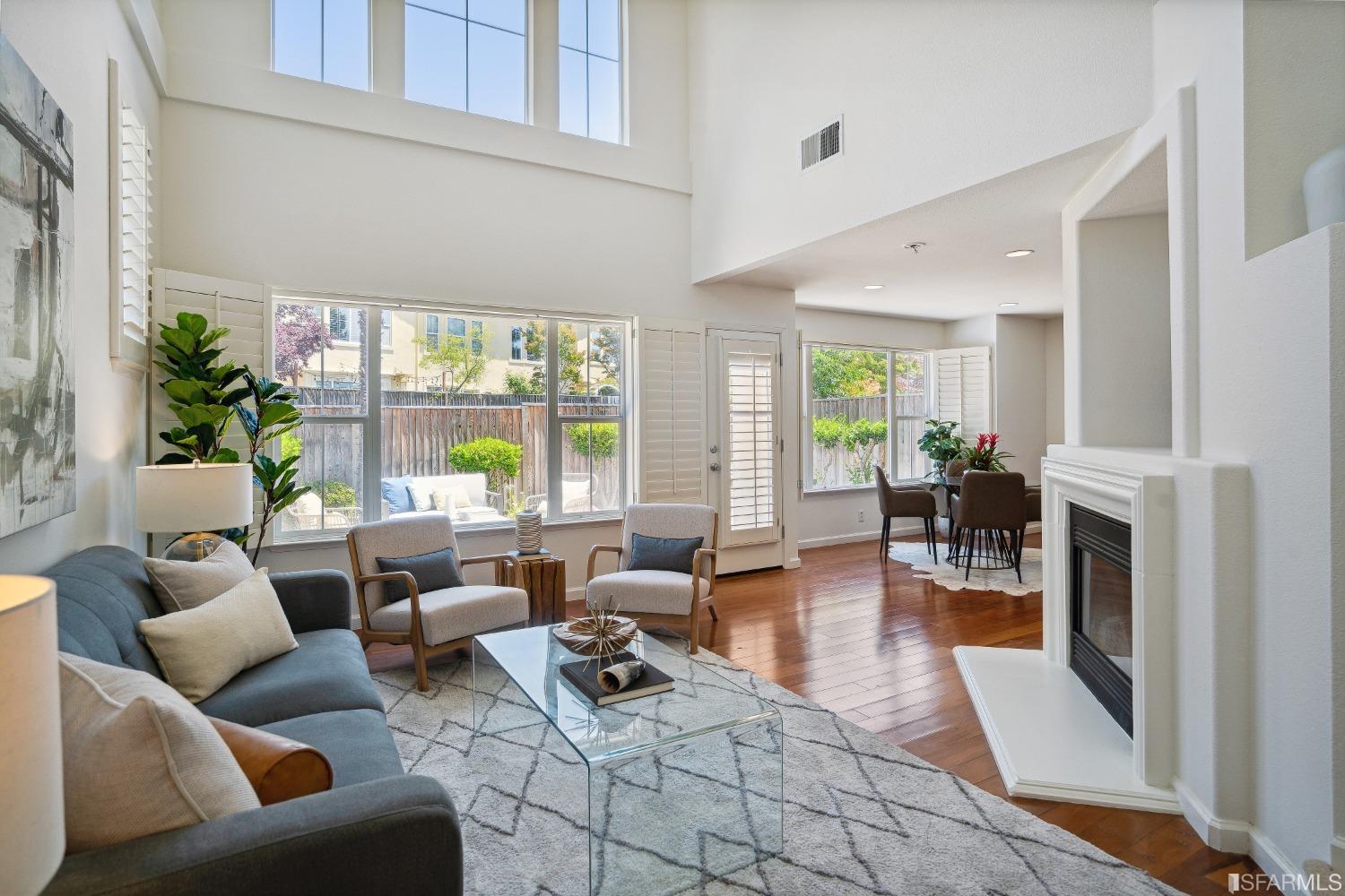7531 Imperata Lane San Ramon, CA 94582 - Photo 9 of 37 a living room with furniture large window and wooden floor