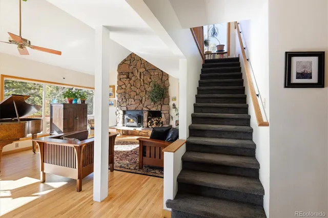 a view of entryway and hall with wooden floor