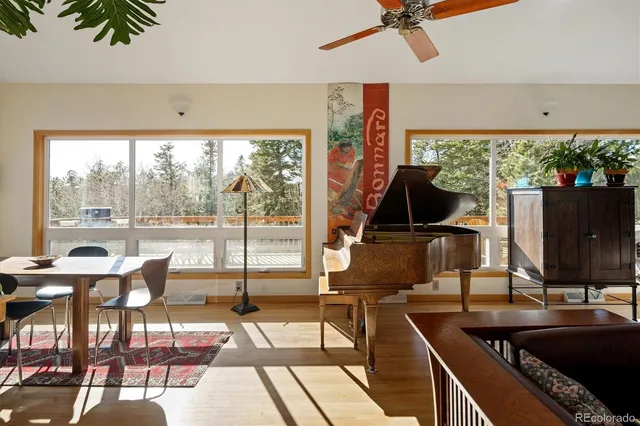 a view of a living room and dining room