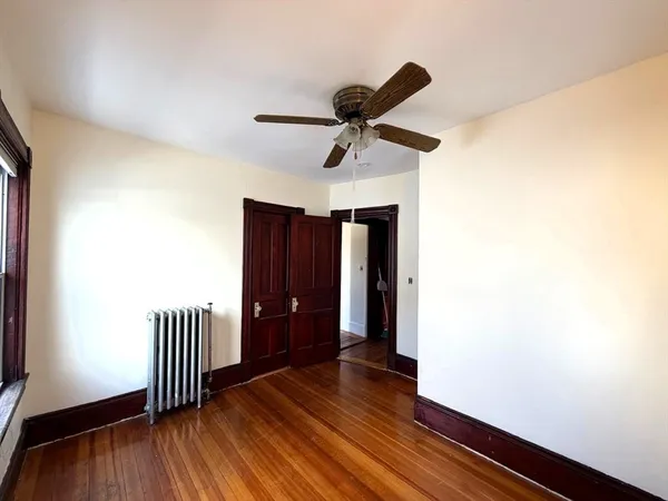 a view of hallway with wooden floor