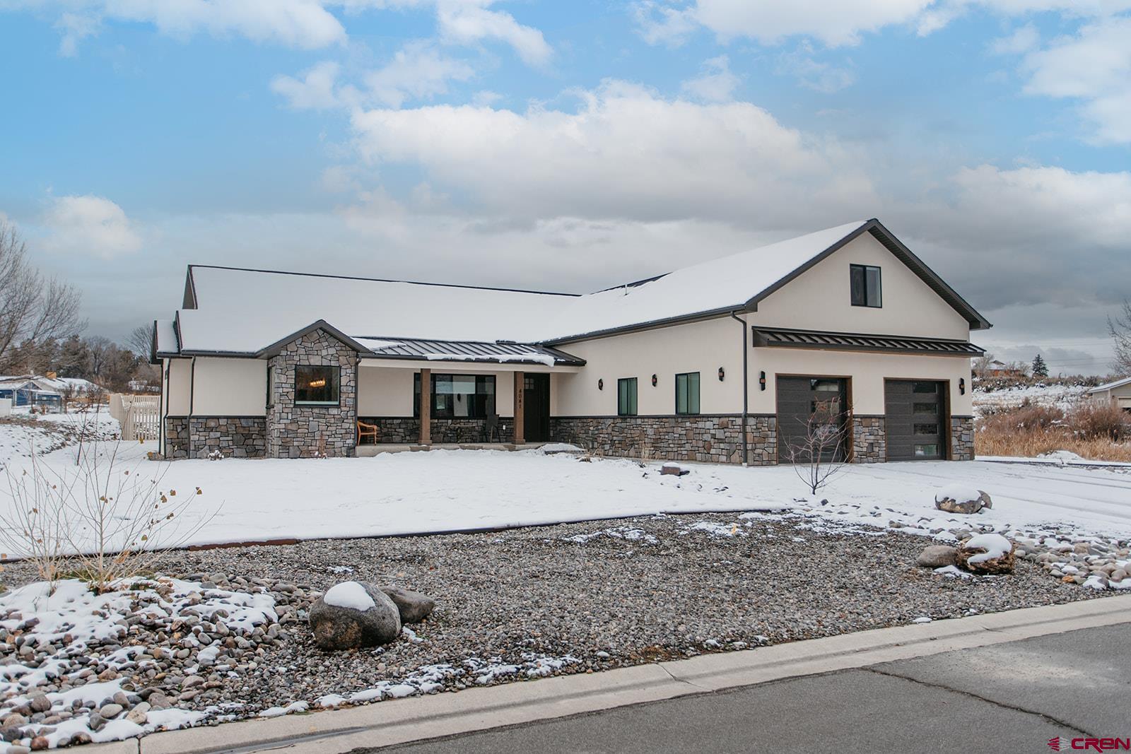 4041 Pioneer Road Montrose, CO 81403 - Photo 1 of 43 a front view of a house with a yard