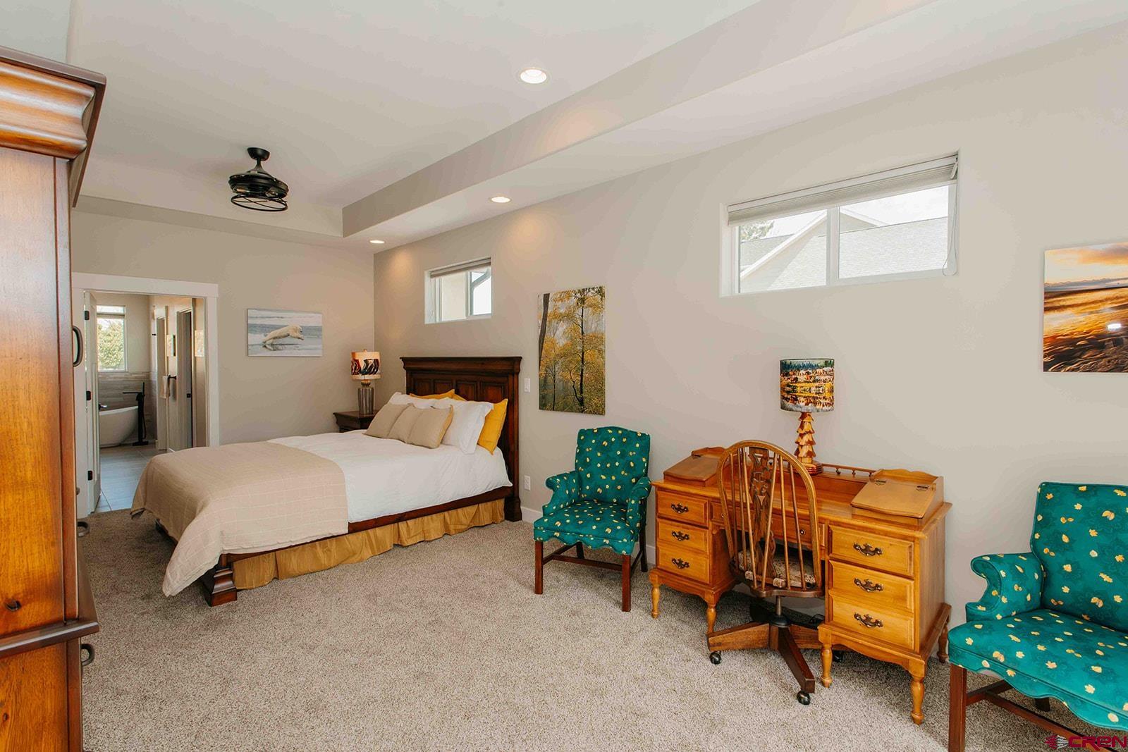 4041 Pioneer Road Montrose, CO 81403 - Photo 11 of 43 a bedroom with a bed and a cabinets