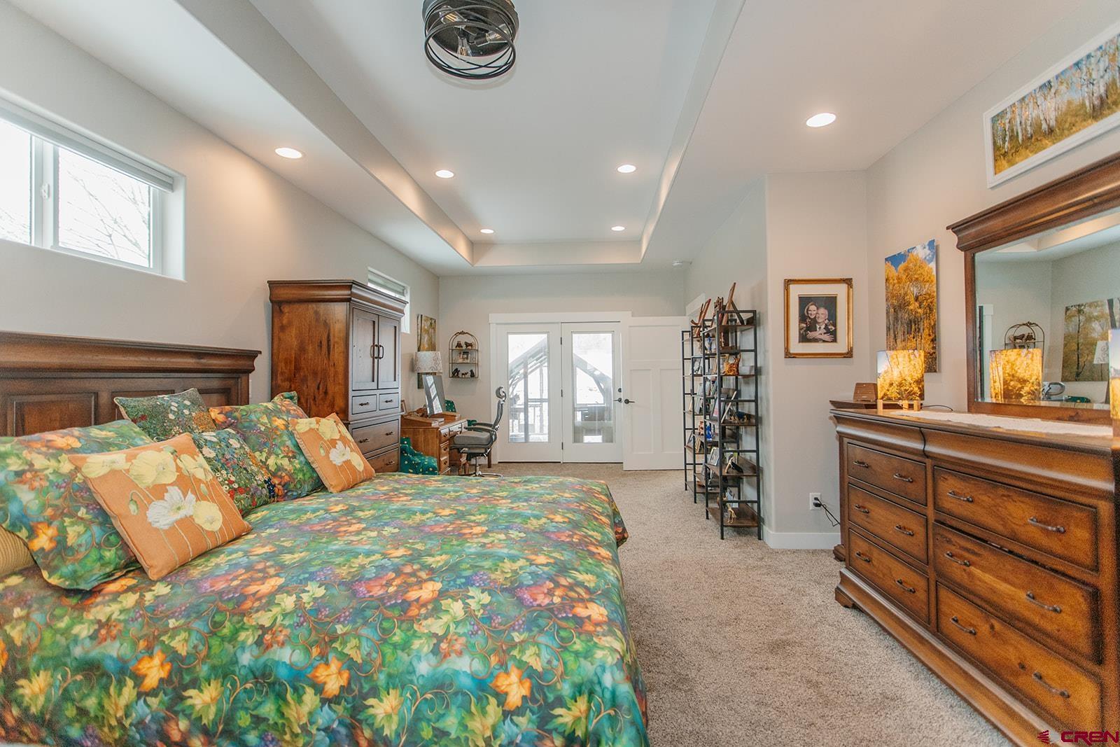 4041 Pioneer Road Montrose, CO 81403 - Photo 14 of 43 a large bedroom with bed and window