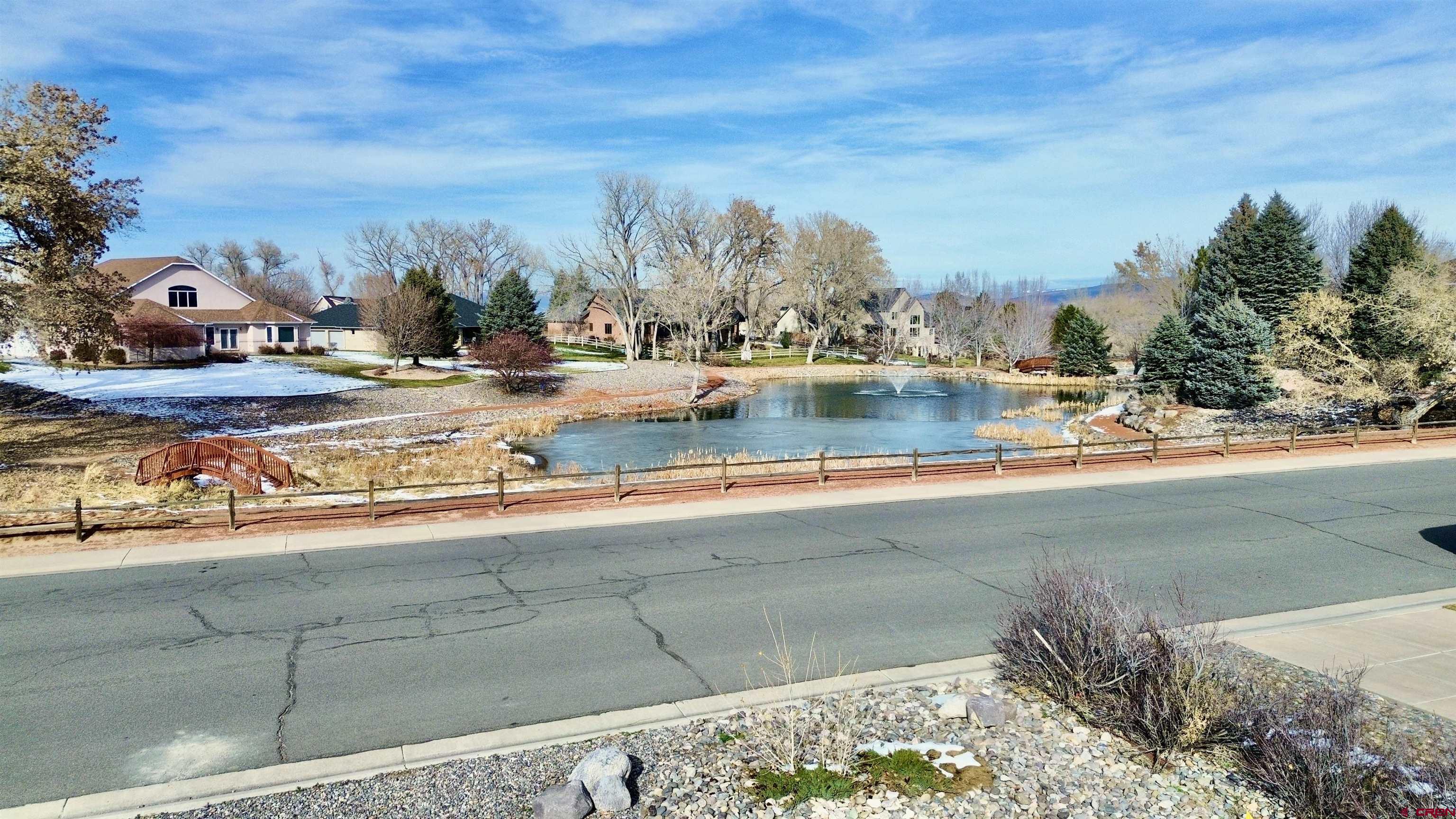 4041 Pioneer Road Montrose, CO 81403 - Photo 2 of 43 a view of a lake with houses