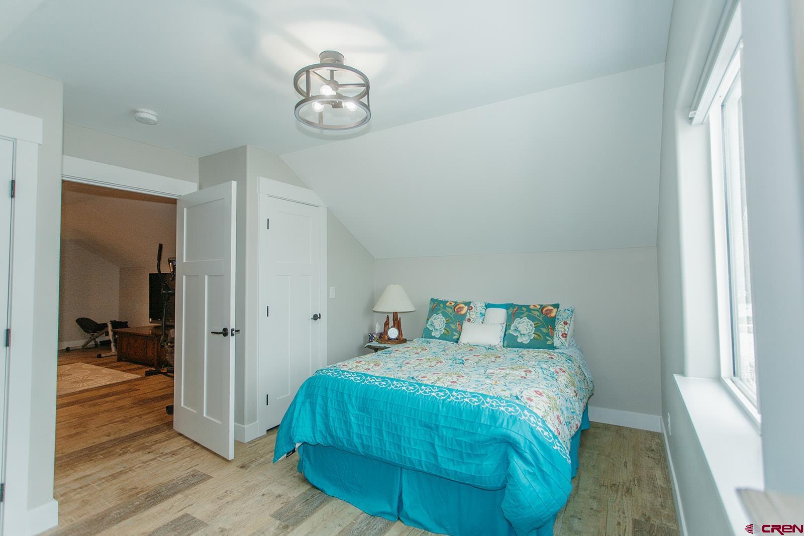 4041 Pioneer Road Montrose, CO 81403 - Photo 26 of 43 a bedroom with a bed and a window
