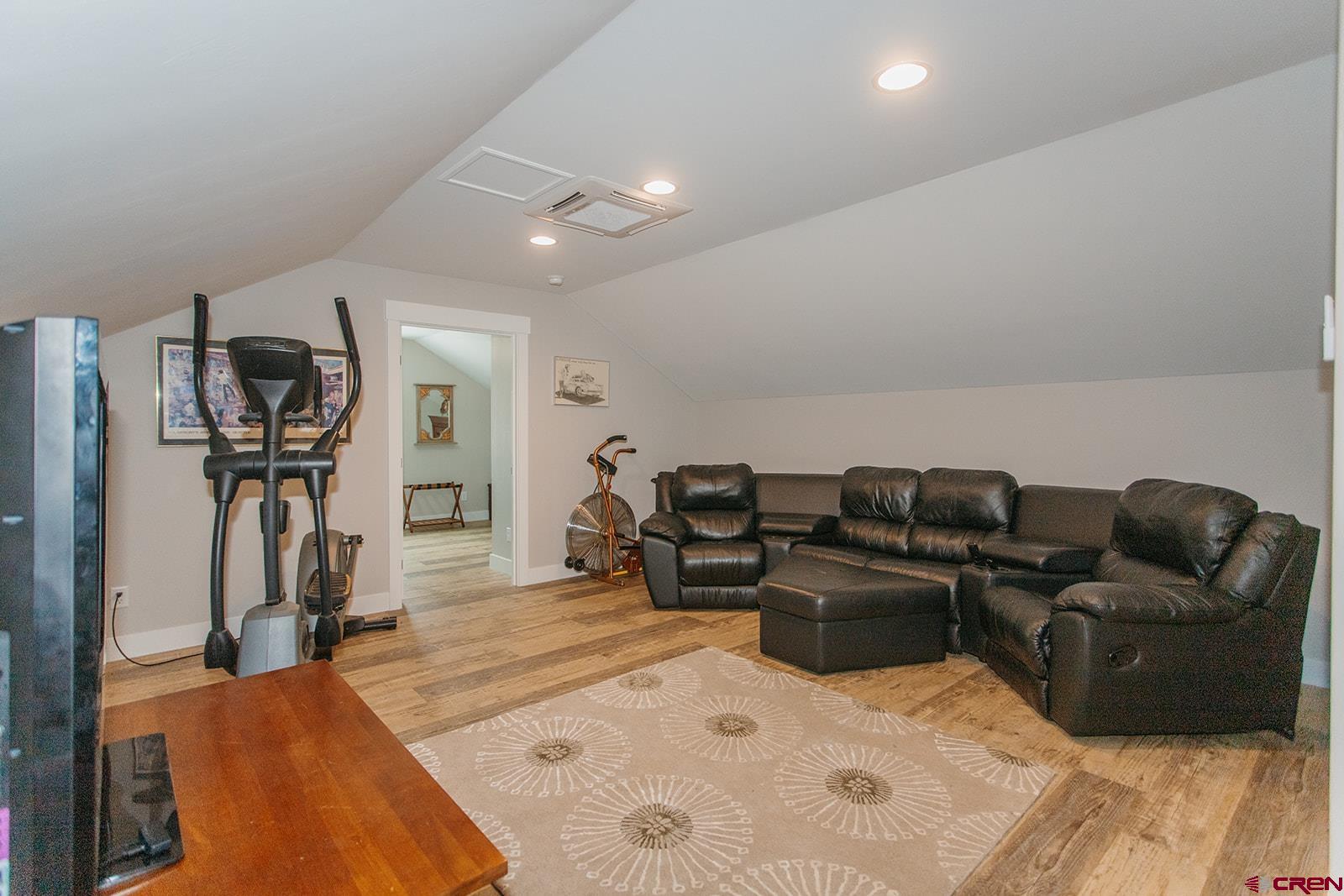 4041 Pioneer Road Montrose, CO 81403 - Photo 27 of 43 a living room with furniture a gym equipment and a large window