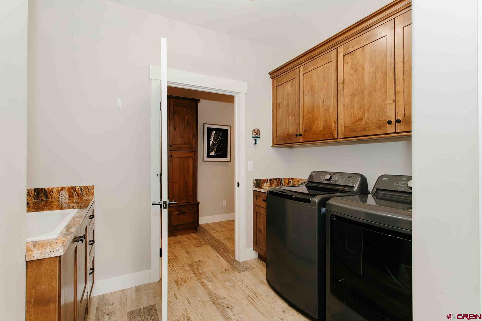 4041 Pioneer Road Montrose, CO 81403 - Photo 27 of 43 a kitchen with a stove top oven and refrigerator