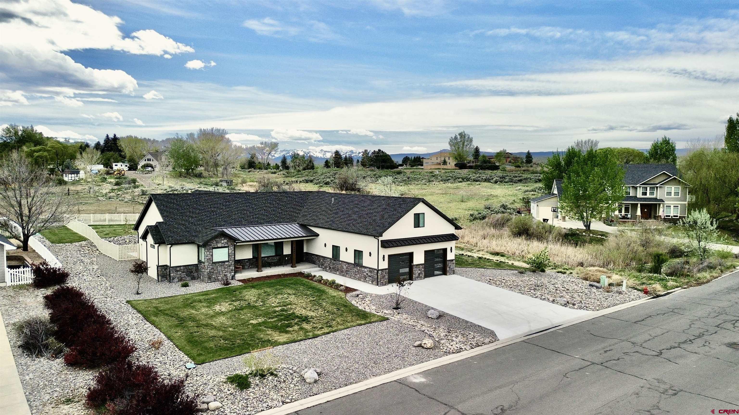 4041 Pioneer Road Montrose, CO 81403 - Photo 39 of 43 an aerial view of a house with garden space and street view