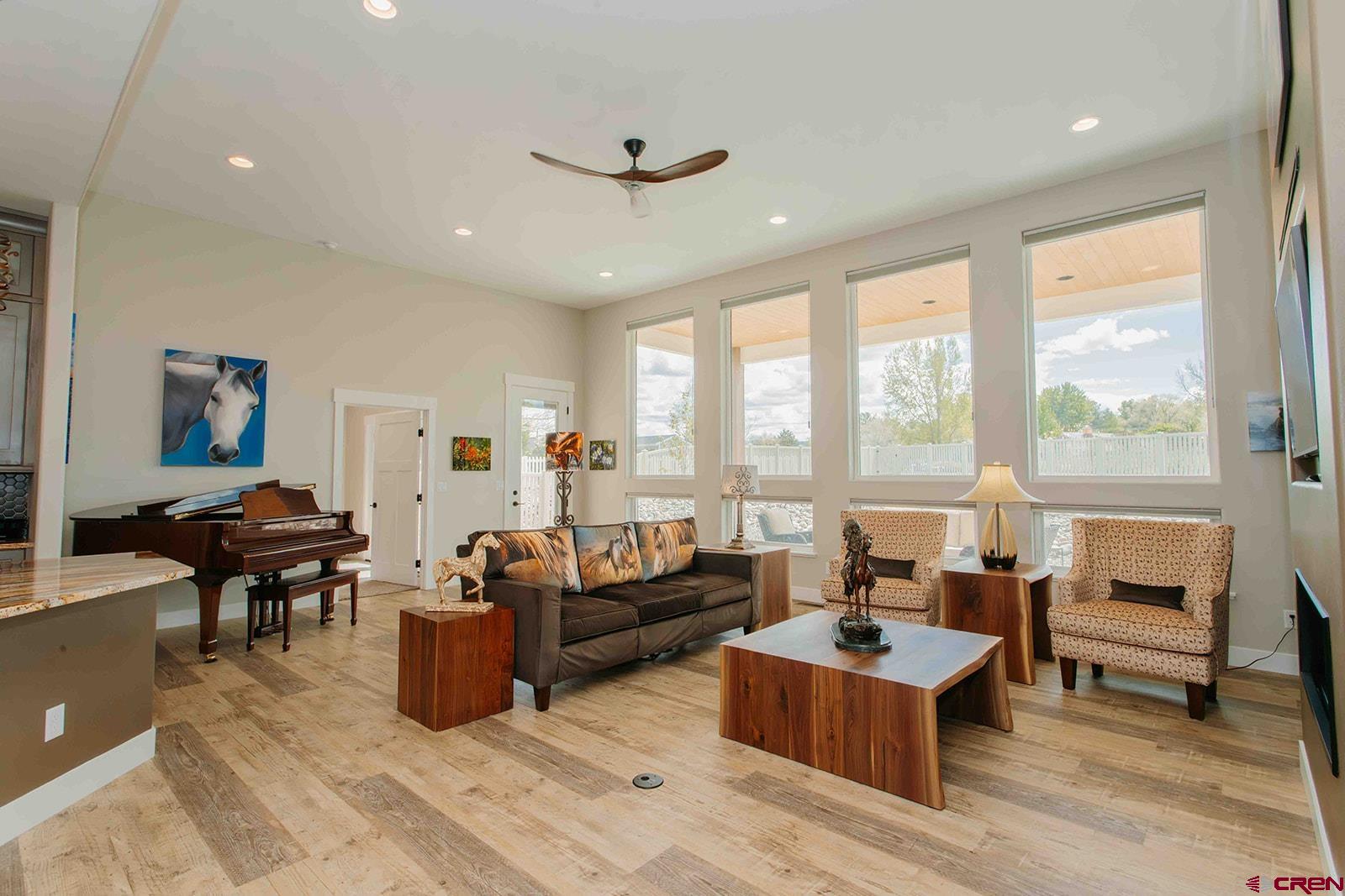 4041 Pioneer Road Montrose, CO 81403 - Photo 5 of 43 a living room with fireplace furniture and a large window