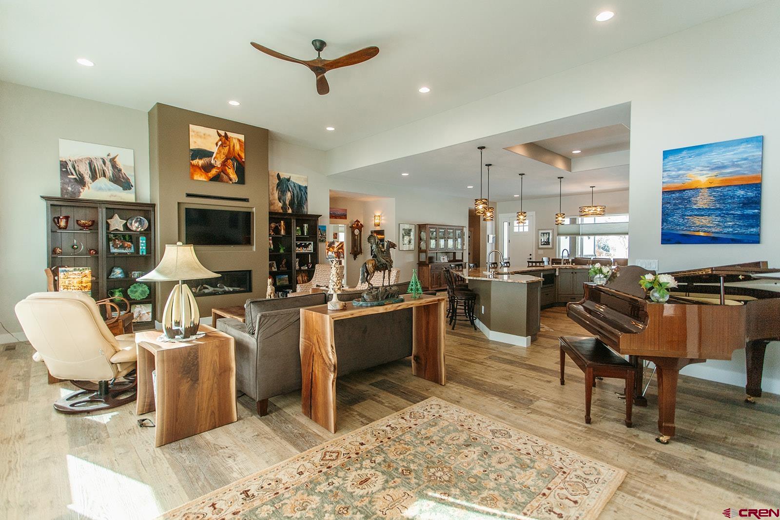 4041 Pioneer Road Montrose, CO 81403 - Photo 5 of 43 a living room with stainless steel appliances kitchen island granite countertop furniture and a rug