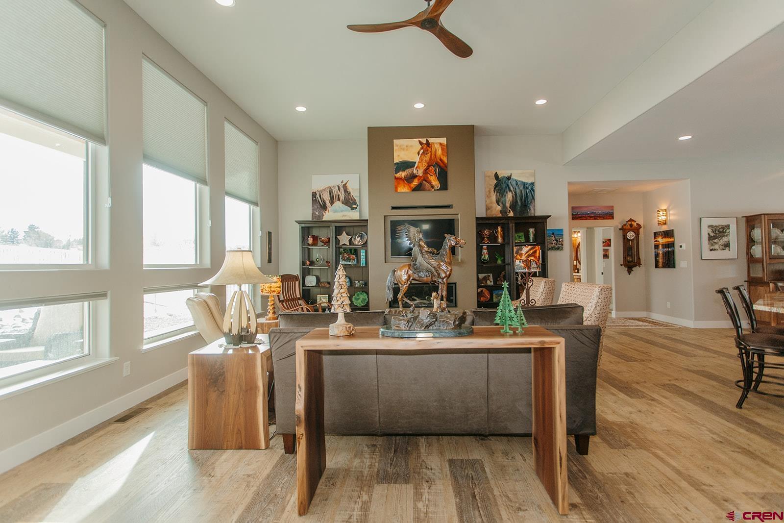 4041 Pioneer Road Montrose, CO 81403 - Photo 6 of 43 a view of a dining room with furniture window and wooden floor