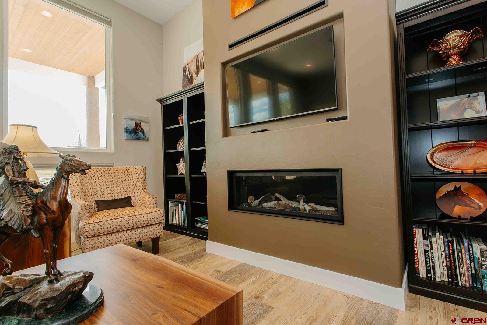 4041 Pioneer Road Montrose, CO 81403 - Photo 6 of 43 a living room with furniture and a flat screen tv