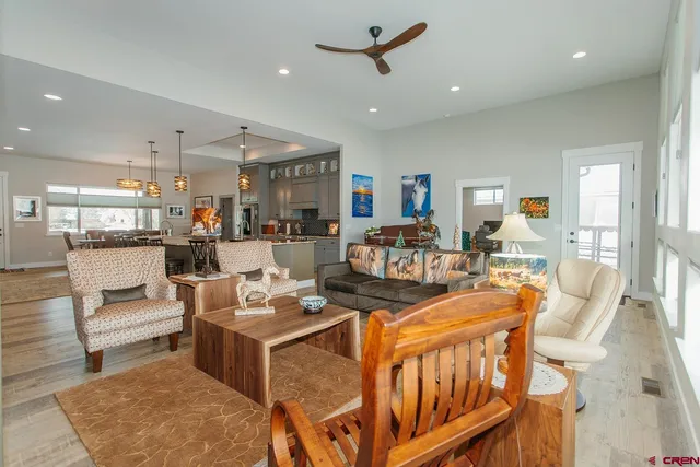 a living room with fireplace furniture and a rug