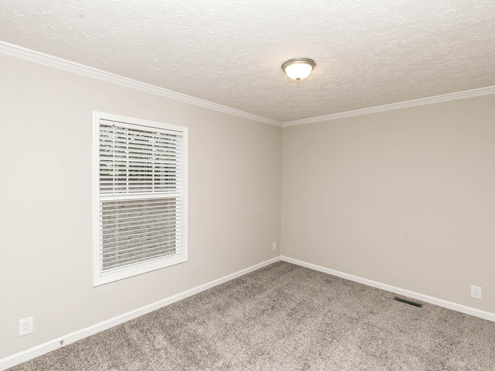 1650 Moulton Road Louisburg, NC 27549 - Photo 11 of 23 a view of an empty room with a window