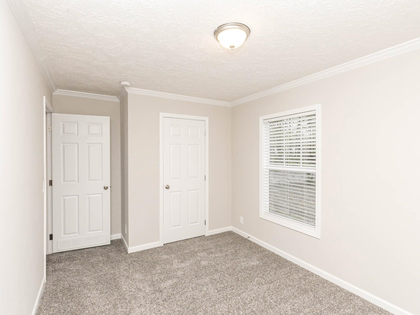 1650 Moulton Road Louisburg, NC 27549 - Photo 12 of 23 an empty room with windows