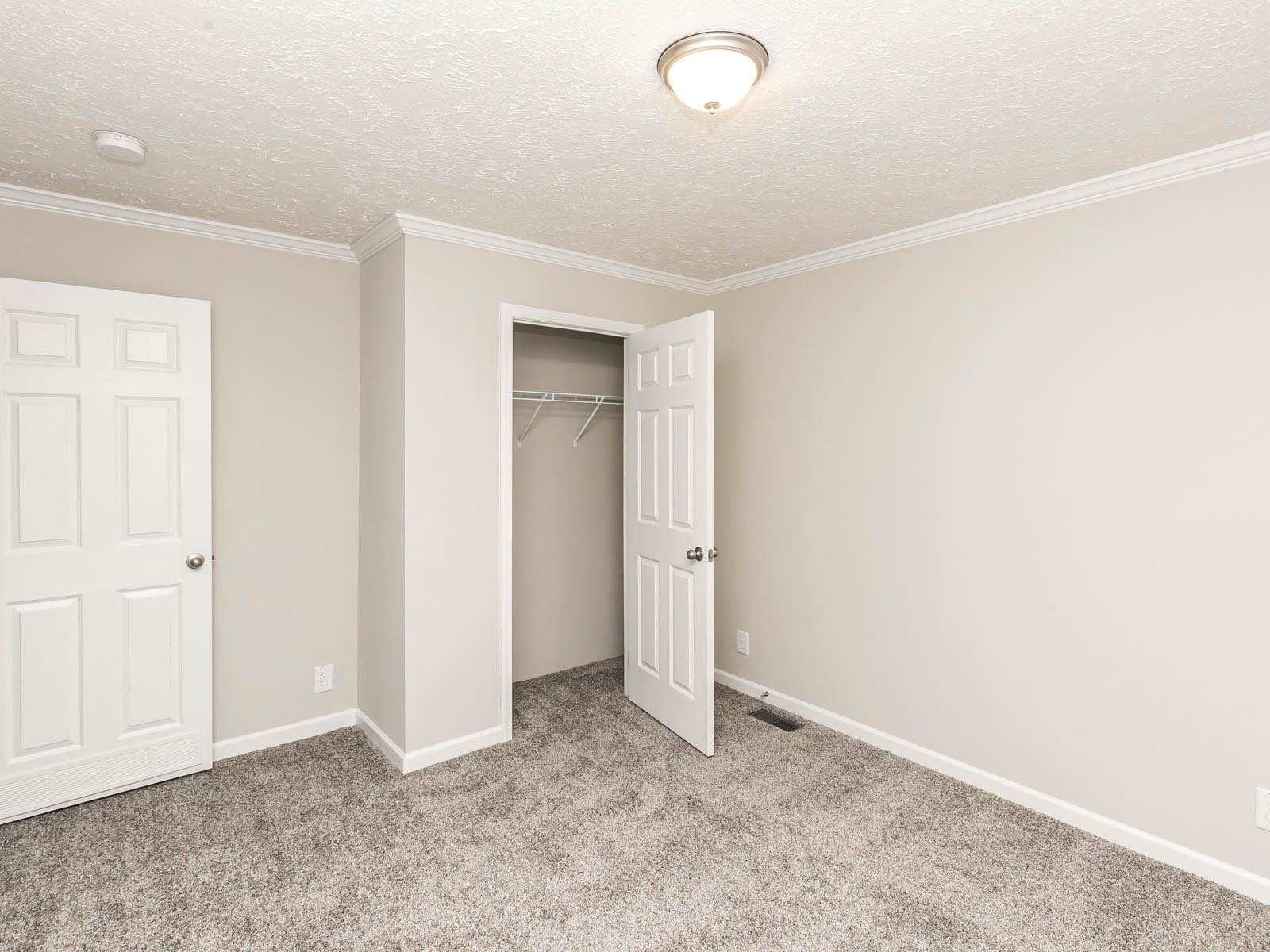 1650 Moulton Road Louisburg, NC 27549 - Photo 13 of 23 an empty room with closet area