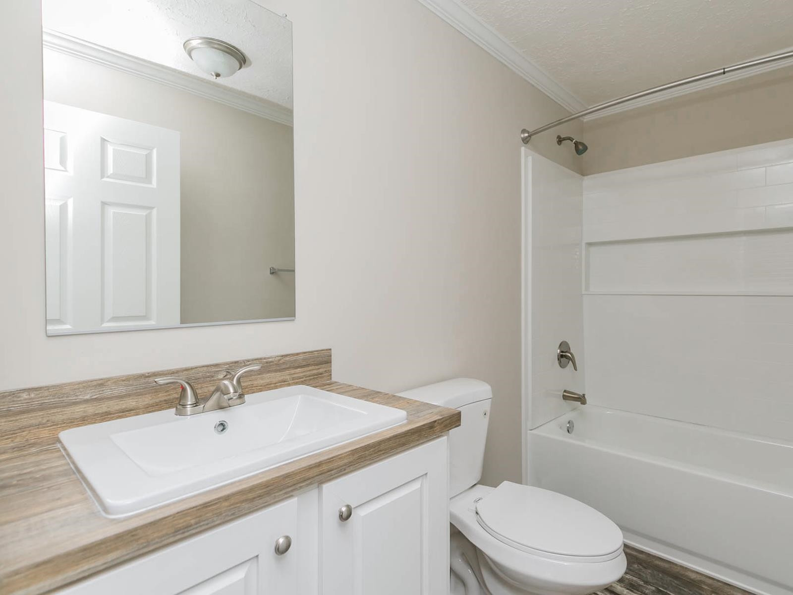 1650 Moulton Road Louisburg, NC 27549 - Photo 14 of 23 a bathroom with a sink a toilet and shower