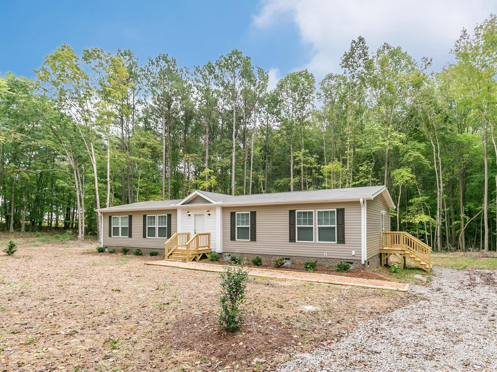 1650 Moulton Road Louisburg, NC 27549 - Photo 2 of 23 front view of a house with a patio
