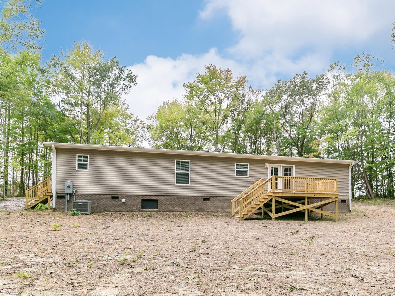 1650 Moulton Road Louisburg, NC 27549 - Photo 22 of 23 a view of a house with a backyard