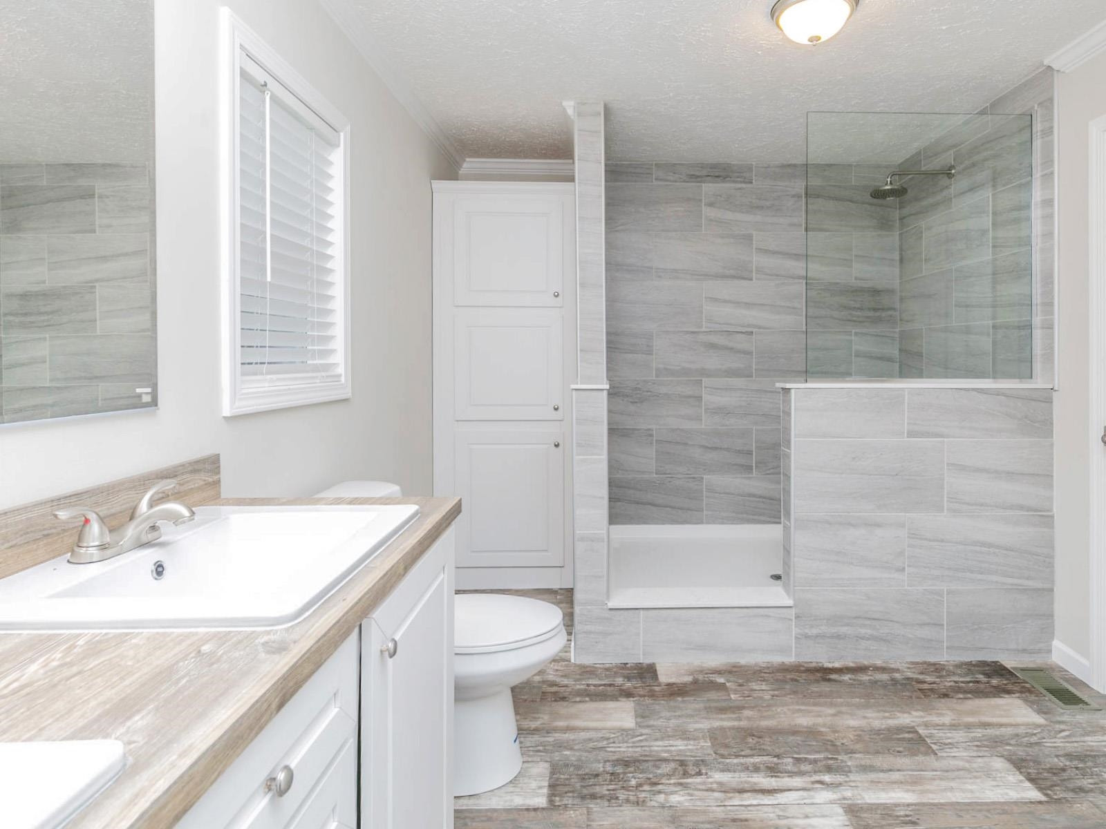 1650 Moulton Road Louisburg, NC 27549 - Photo 9 of 23 a bathroom with a sink a toilet and shower