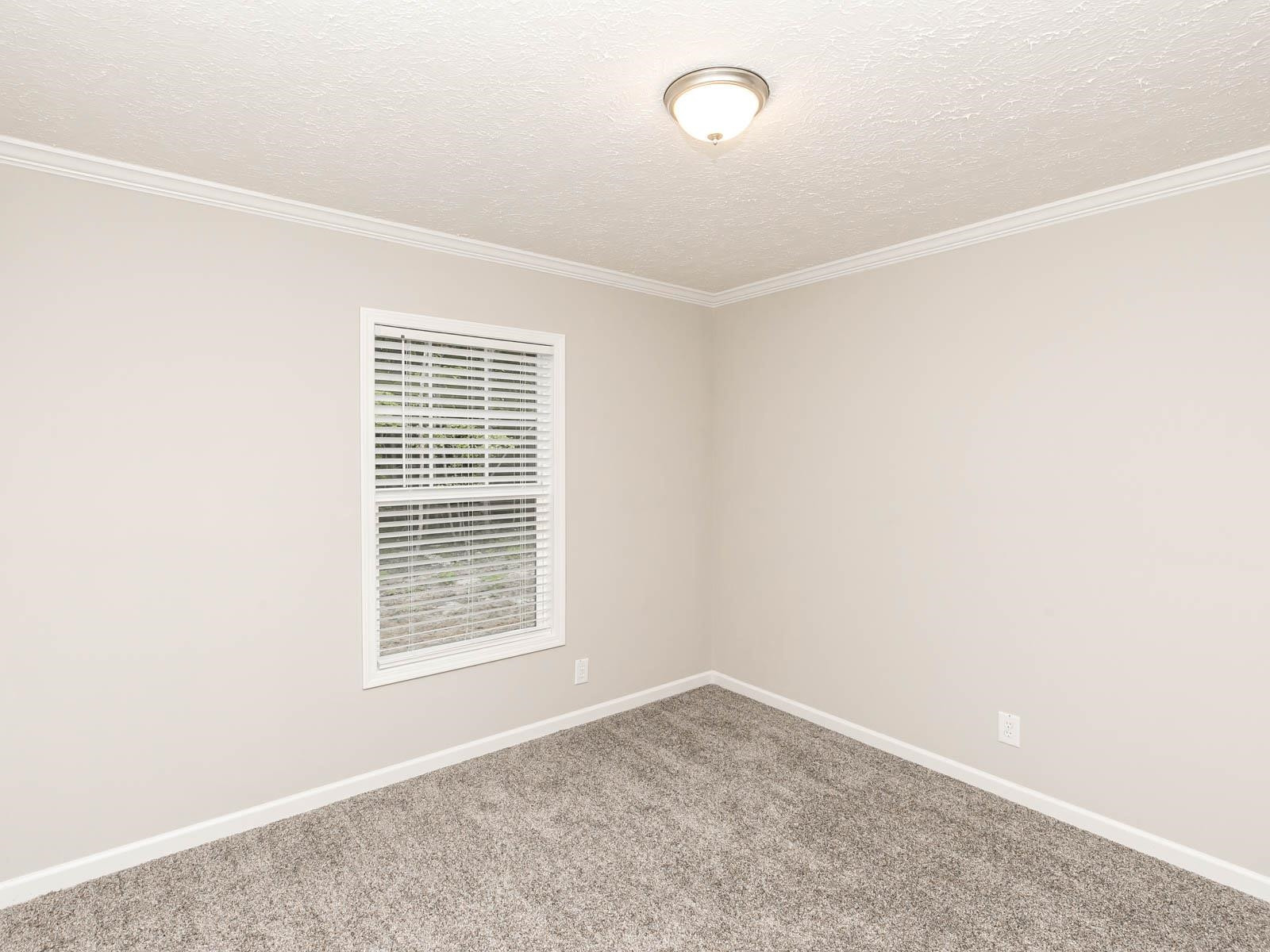 1650 Moulton Road Louisburg, NC 27549 - Photo 10 of 23 an empty room with windows