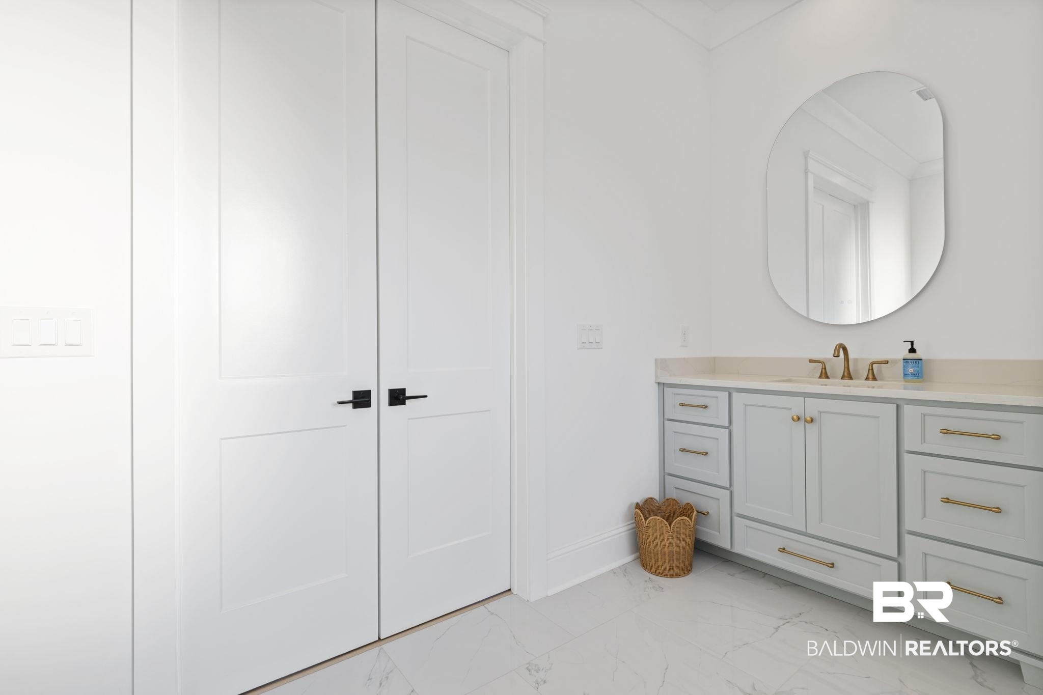 30313 River Road Orange Beach, AL 36561 - Photo 45 of 50 Bathroom with vanity and light marble finish floors
