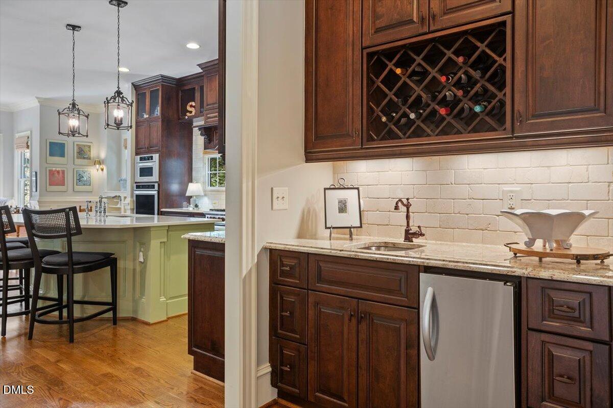 3916 Laurel Manor Court Raleigh, NC 27612 - Photo 14 of 53 a kitchen with a sink and cabinets
