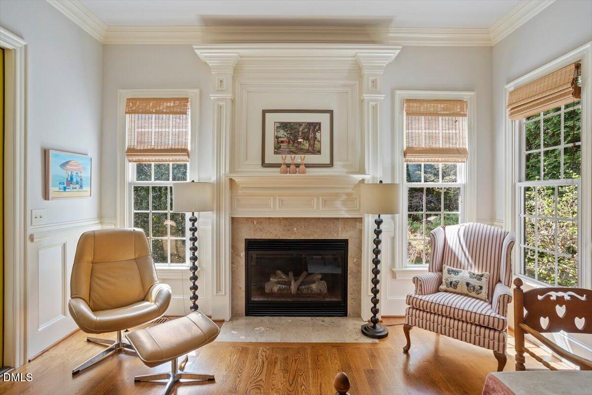 3916 Laurel Manor Court Raleigh, NC 27612 - Photo 19 of 53 a living room with furniture and a fireplace