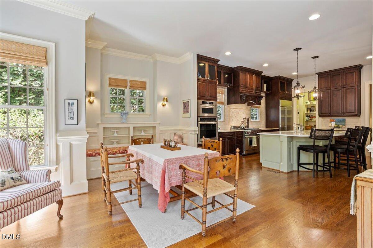 3916 Laurel Manor Court Raleigh, NC 27612 - Photo 20 of 53 a view of a dining room with furniture