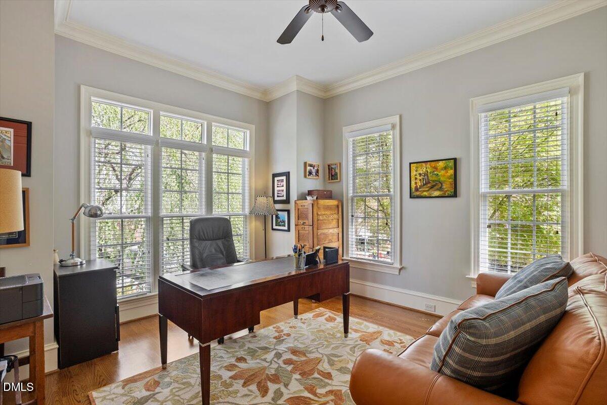 3916 Laurel Manor Court Raleigh, NC 27612 - Photo 21 of 53 a living room with furniture and a window