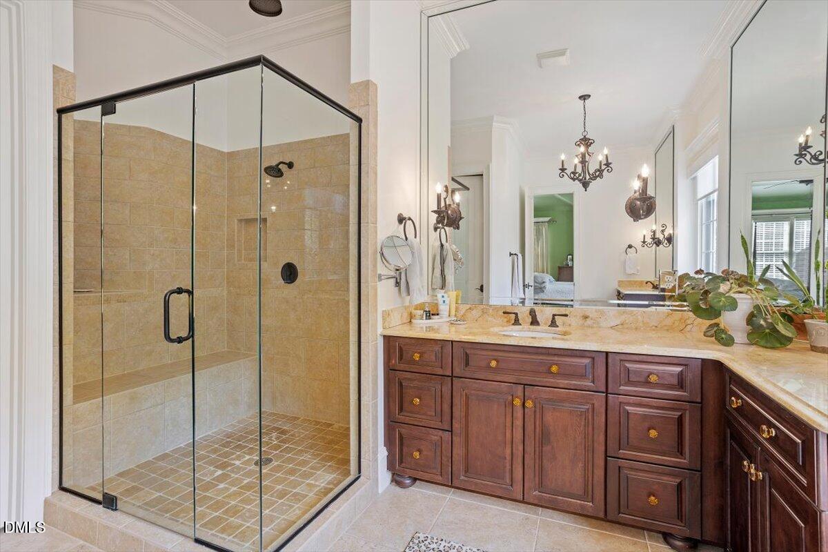 3916 Laurel Manor Court Raleigh, NC 27612 - Photo 27 of 53 a spacious bathroom with a granite countertop sink mirror and shower