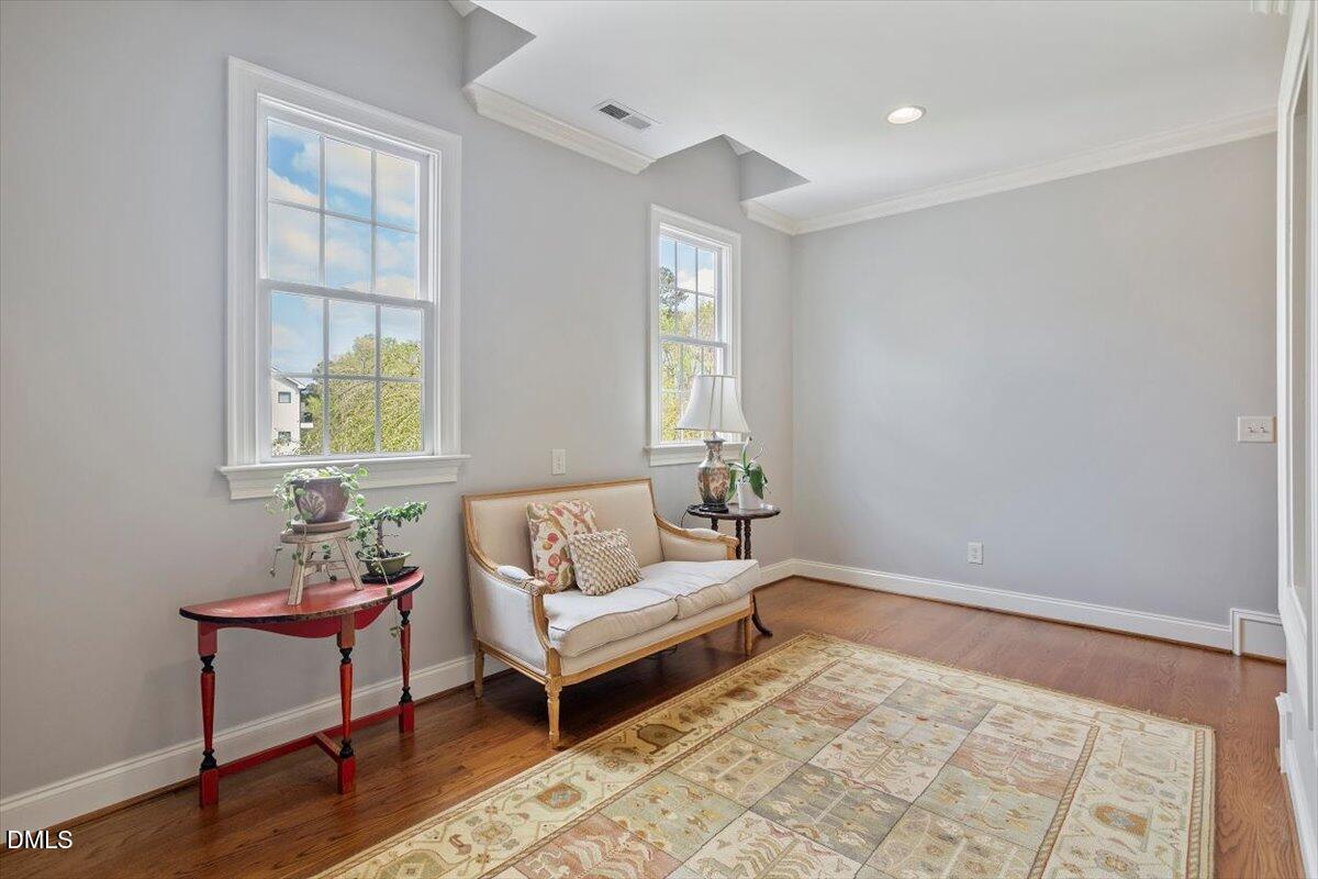 3916 Laurel Manor Court Raleigh, NC 27612 - Photo 30 of 53 a living room with furniture and a window