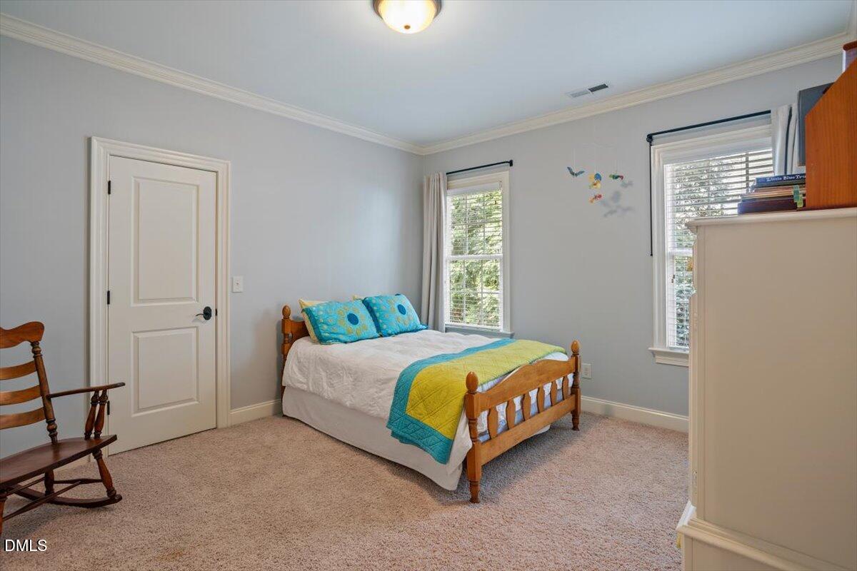 3916 Laurel Manor Court Raleigh, NC 27612 - Photo 38 of 53 a bedroom with a bed and a window
