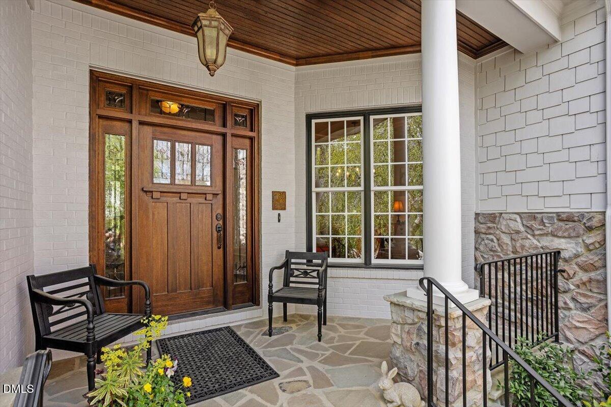 3916 Laurel Manor Court Raleigh, NC 27612 - Photo 3 of 53 a front view of a house with a glass door and furniture