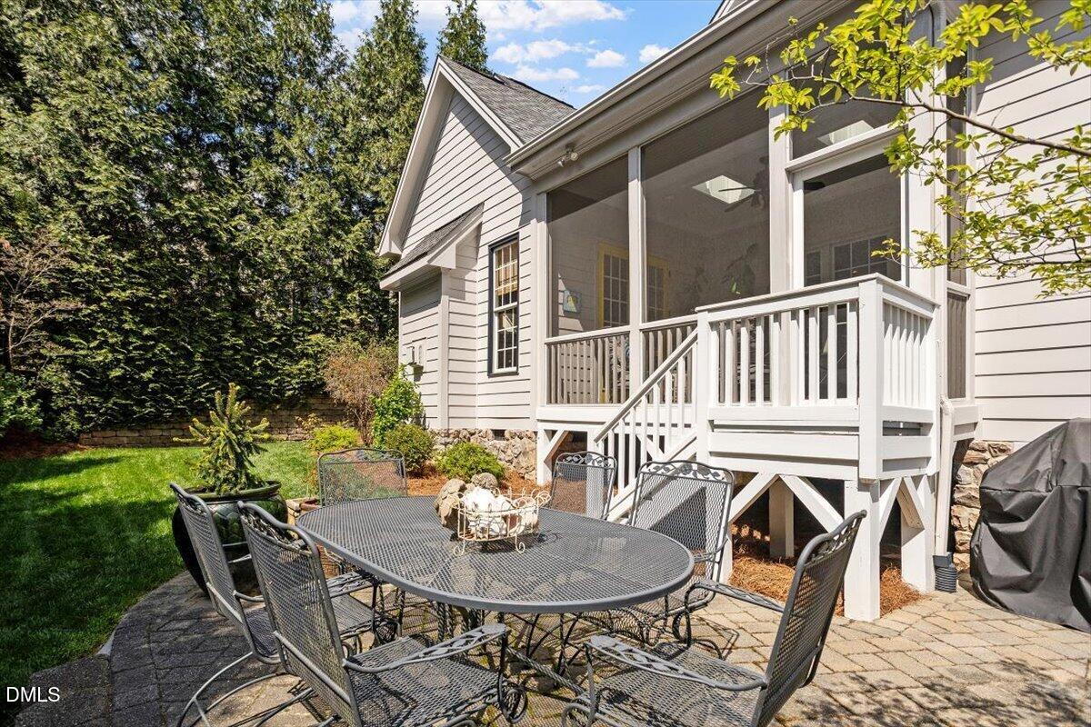 3916 Laurel Manor Court Raleigh, NC 27612 - Photo 49 of 53 a backyard of a house with table and chairs
