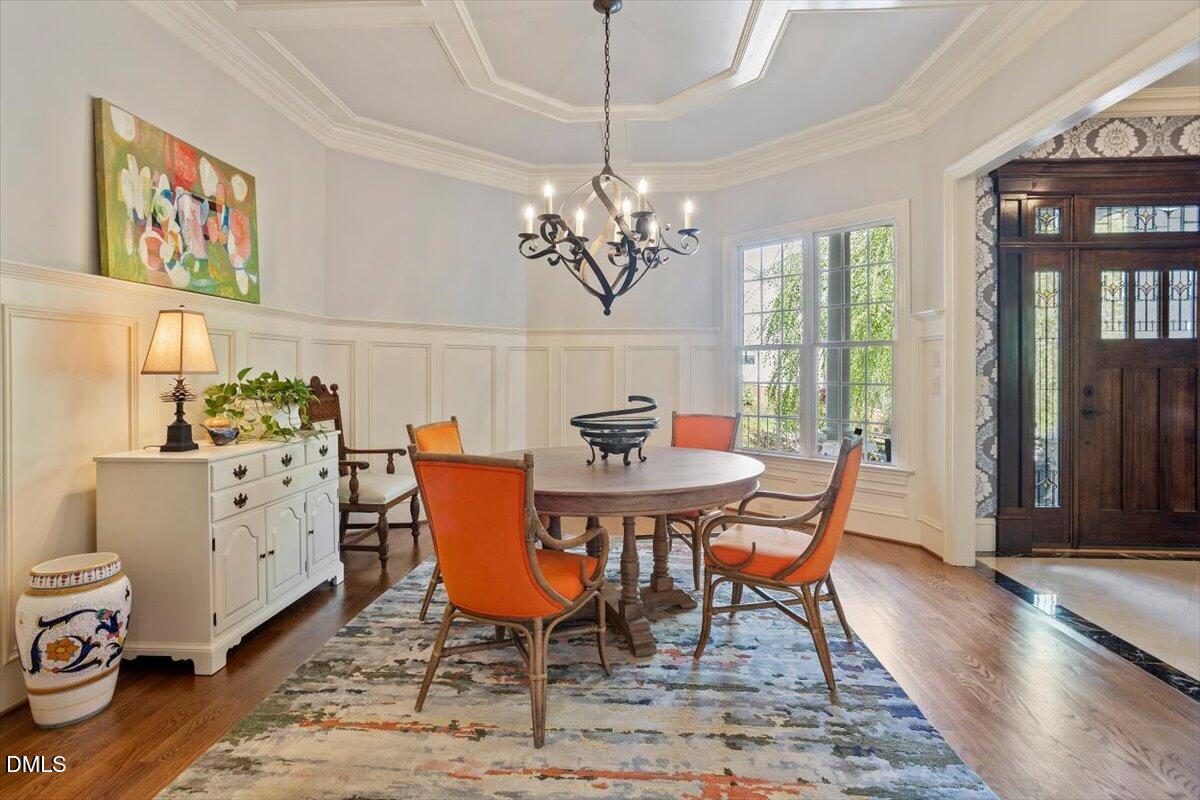 3916 Laurel Manor Court Raleigh, NC 27612 - Photo 7 of 53 a view of a dining room with furniture window and wooden floor