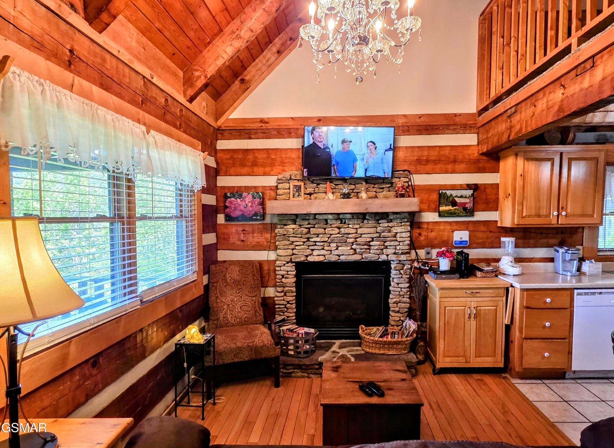 2570 Pittman Center Road Sevierville, TN 37876 - Photo 18 of 61 a living room with furniture and a fireplace