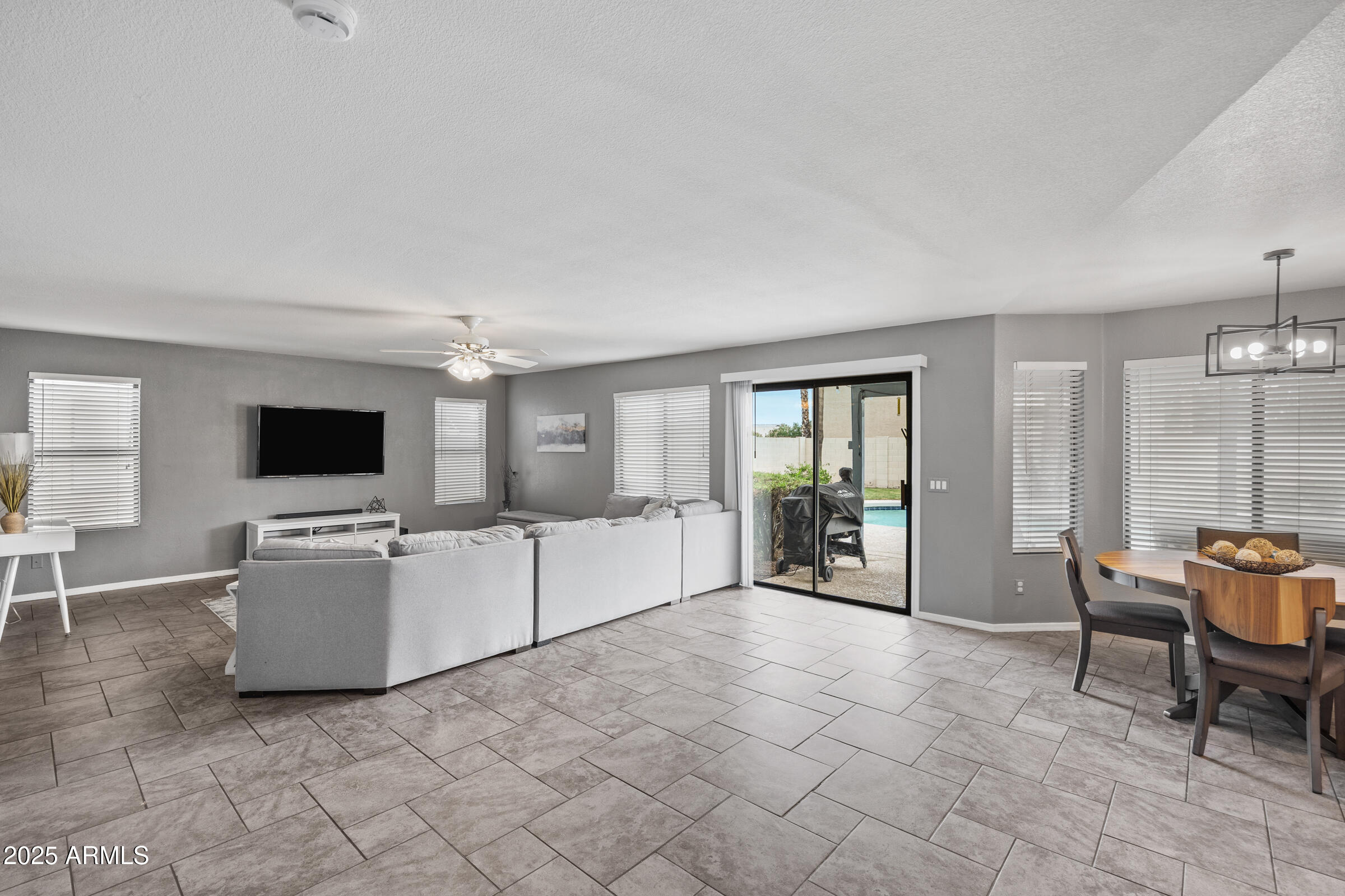 2027 East Parkside Lane Phoenix, AZ 85024 - Photo 19 of 43 a living room with furniture and a flat screen tv