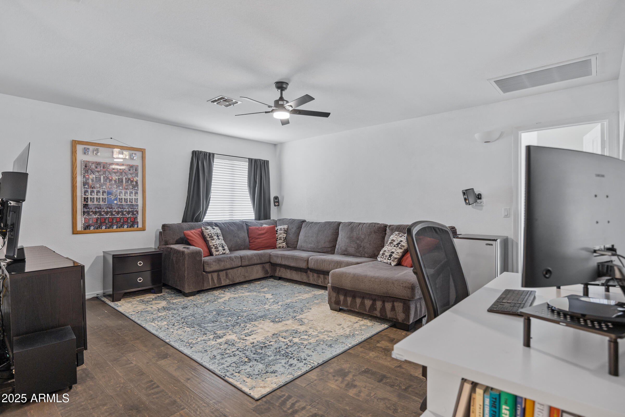 2027 East Parkside Lane Phoenix, AZ 85024 - Photo 30 of 43 a living room with furniture and a chandelier