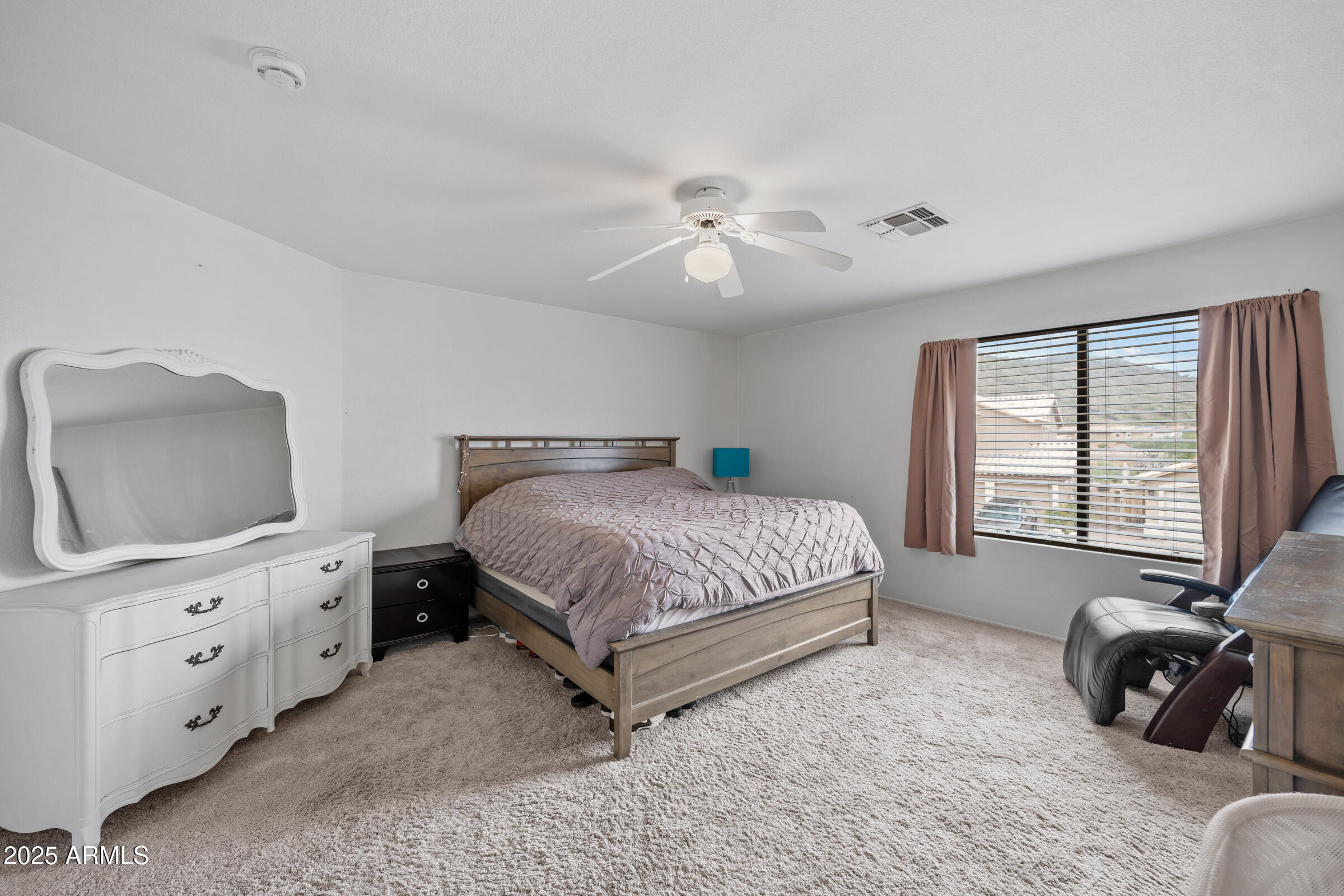 2027 East Parkside Lane Phoenix, AZ 85024 - Photo 35 of 43 a bedroom with a bed and a couch