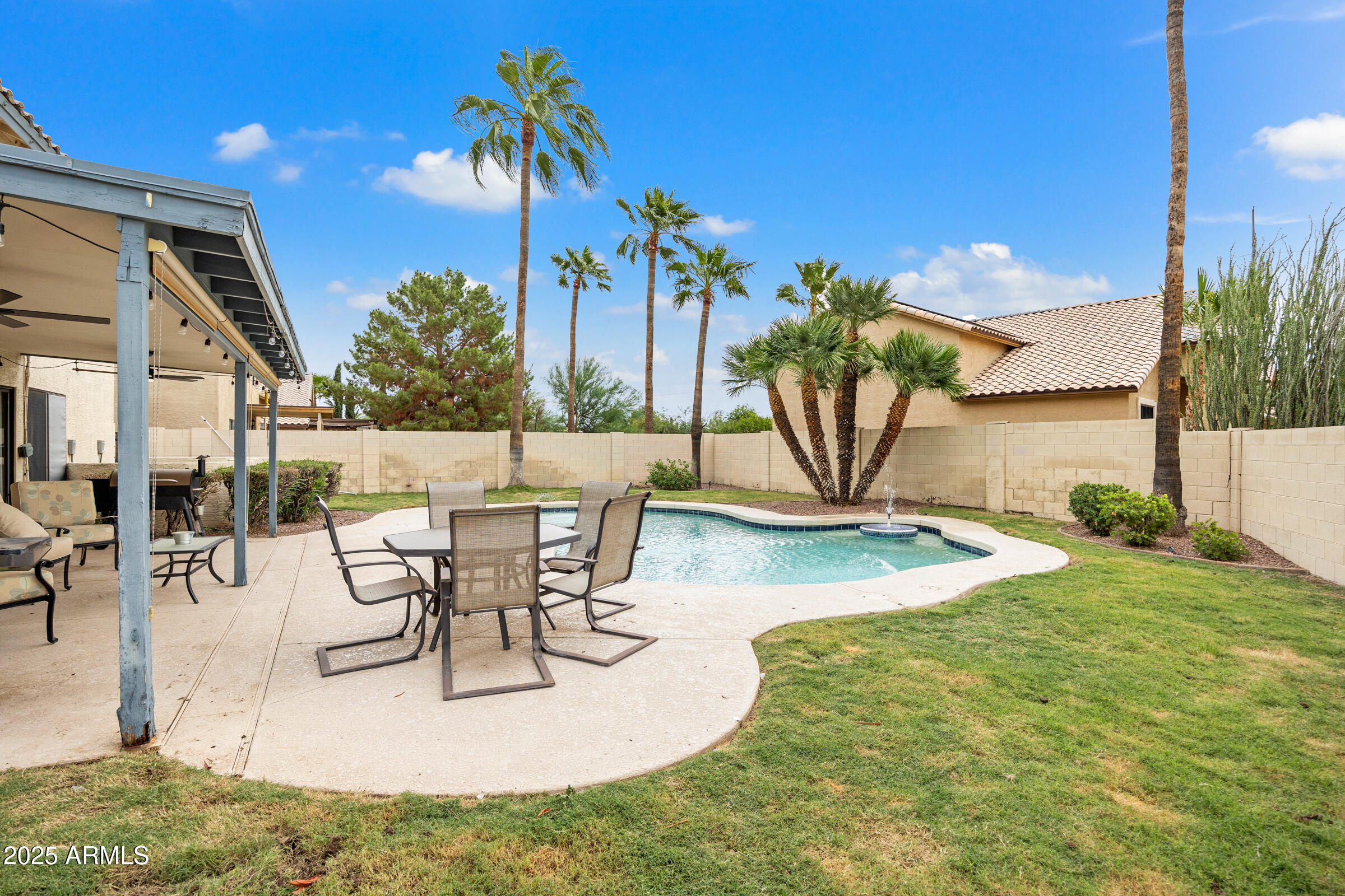2027 East Parkside Lane Phoenix, AZ 85024 - Photo 39 of 43 a view of a swimming pool with a table and chairs