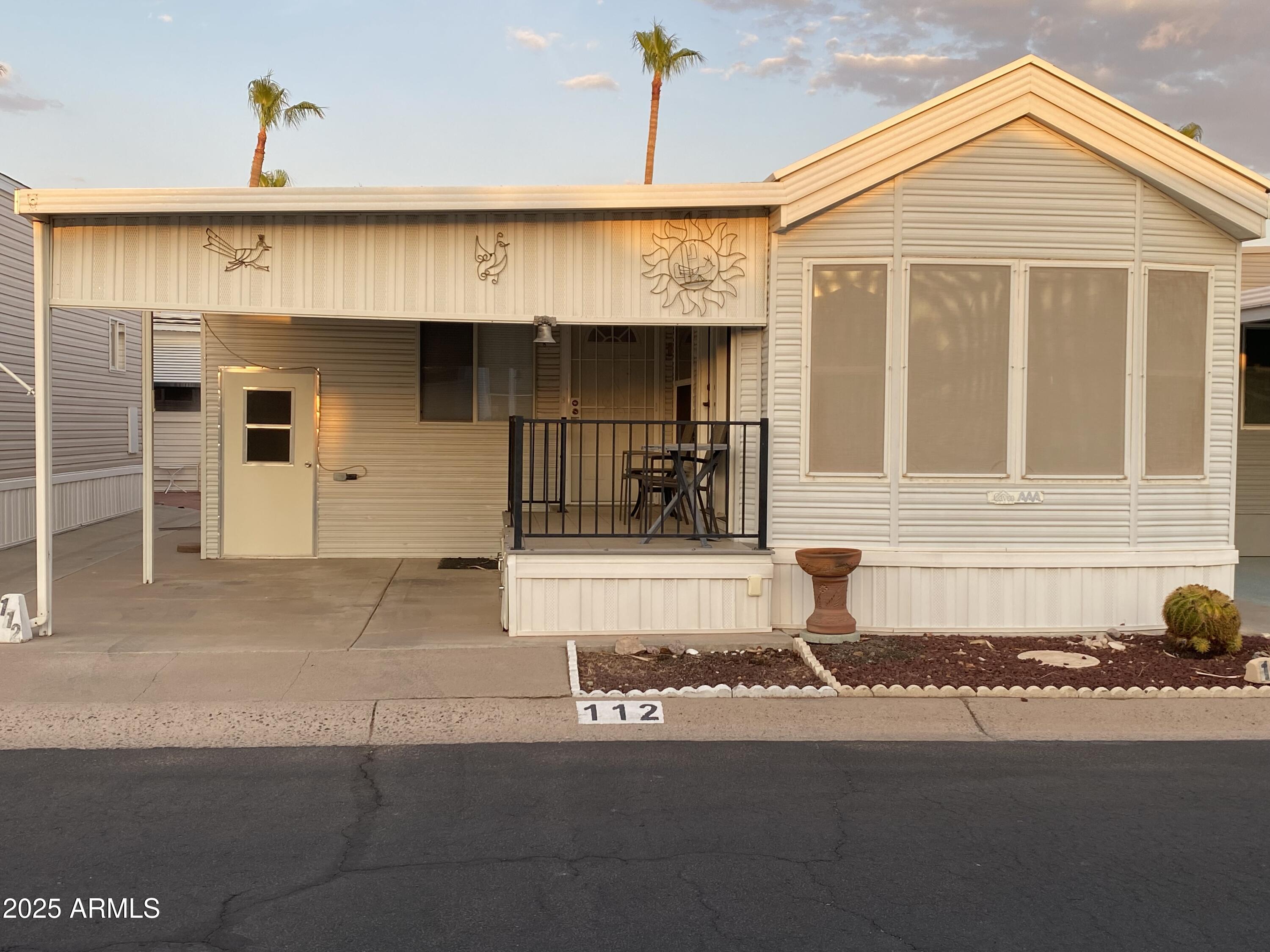 112 Kaolin Drive Apache Junction, AZ 85119 - Photo 1 of 42 a front view of a house with a garage