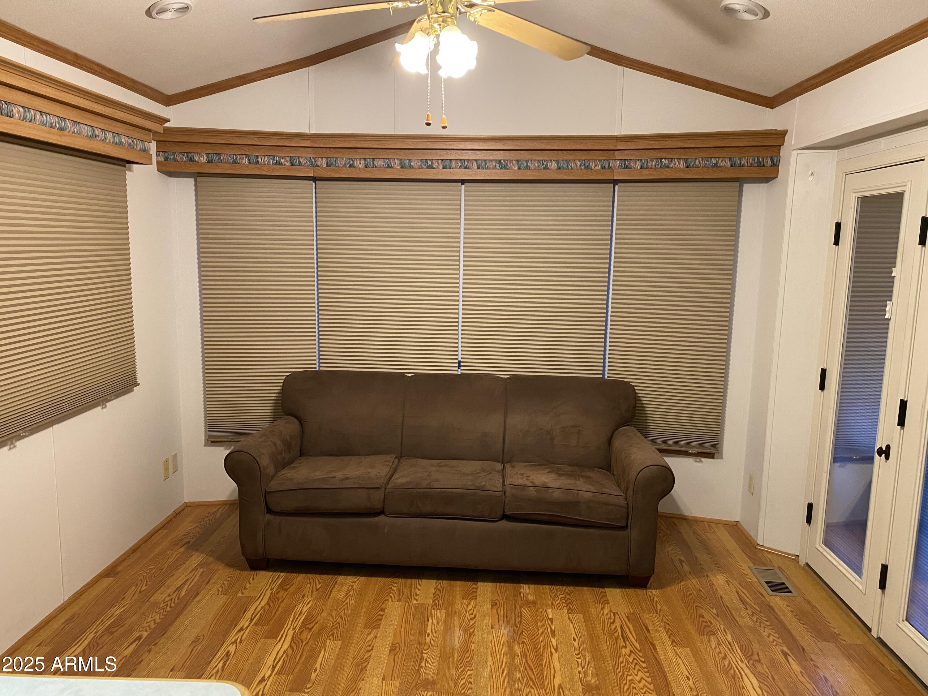 112 Kaolin Drive Apache Junction, AZ 85119 - Photo 11 of 42 a living room with a couch and a rug