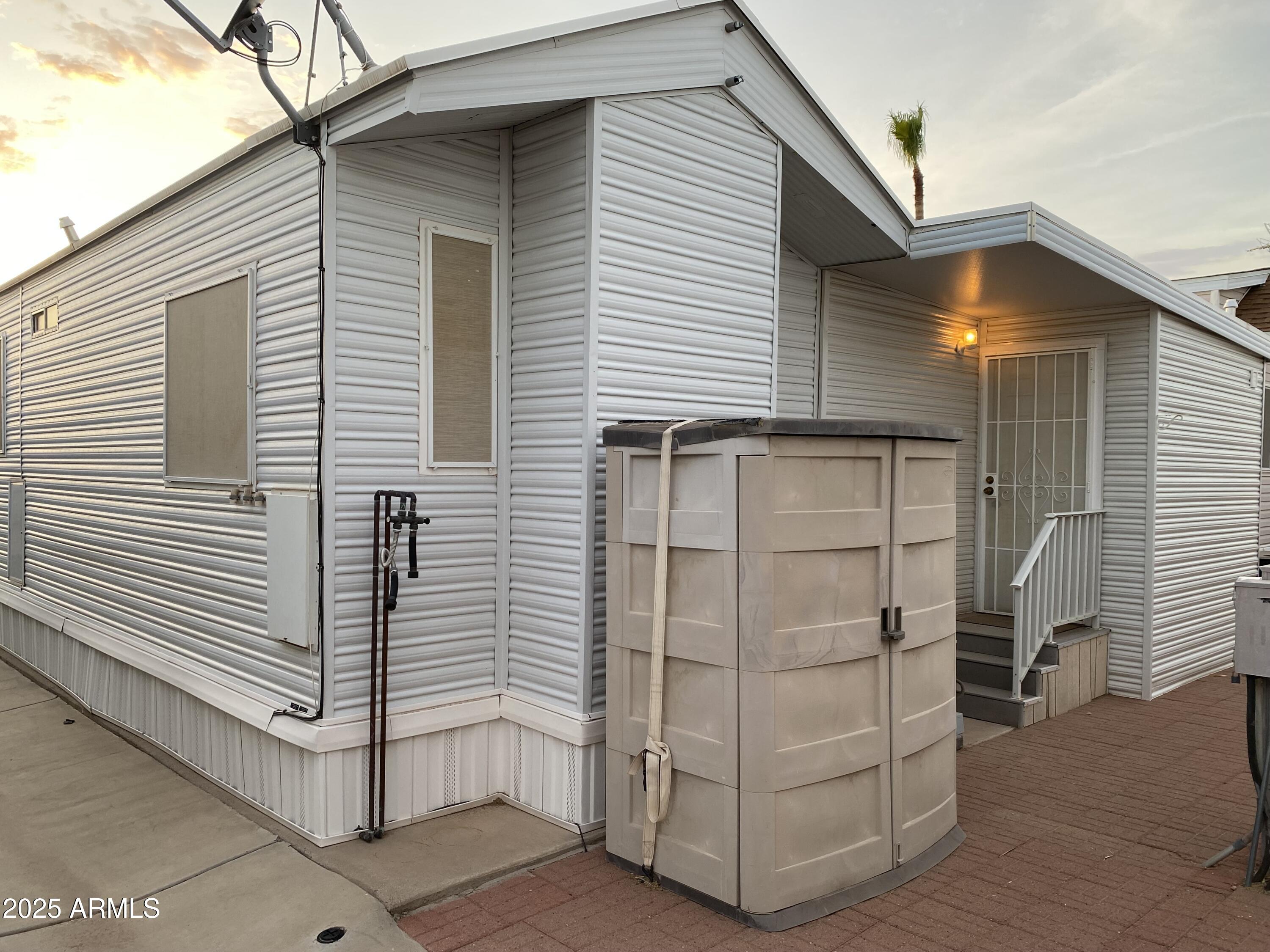 112 Kaolin Drive Apache Junction, AZ 85119 - Photo 31 of 42 a view of a small house with backyard