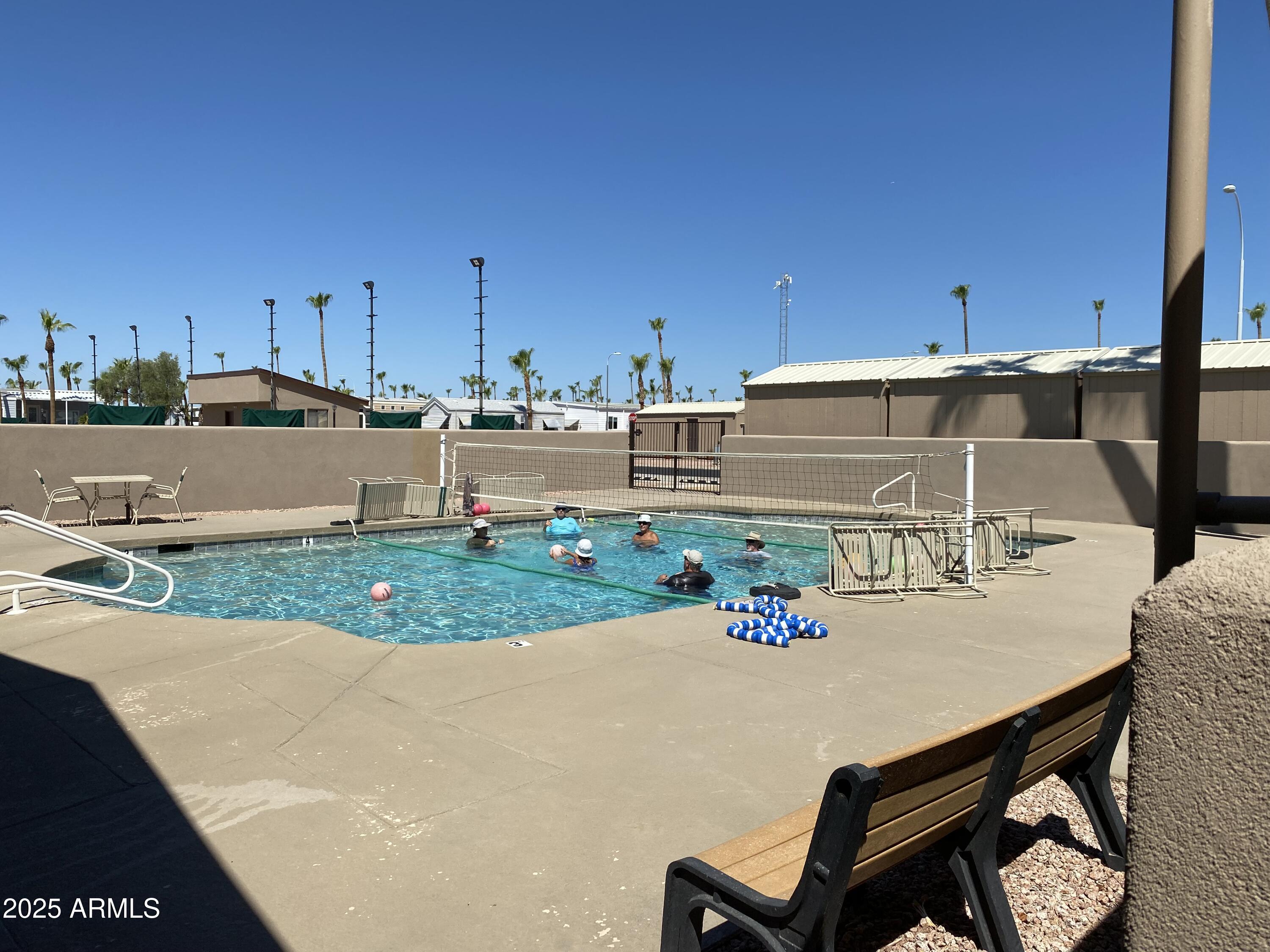 112 Kaolin Drive Apache Junction, AZ 85119 - Photo 38 of 42 a view of a backyard with table and chairs