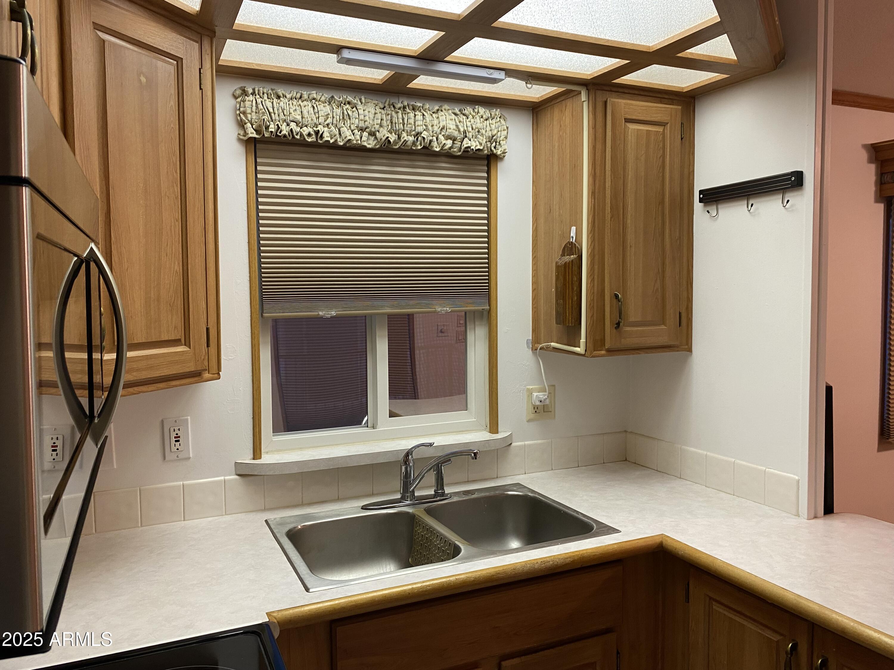 112 Kaolin Drive Apache Junction, AZ 85119 - Photo 6 of 42 a kitchen with a sink and cabinets