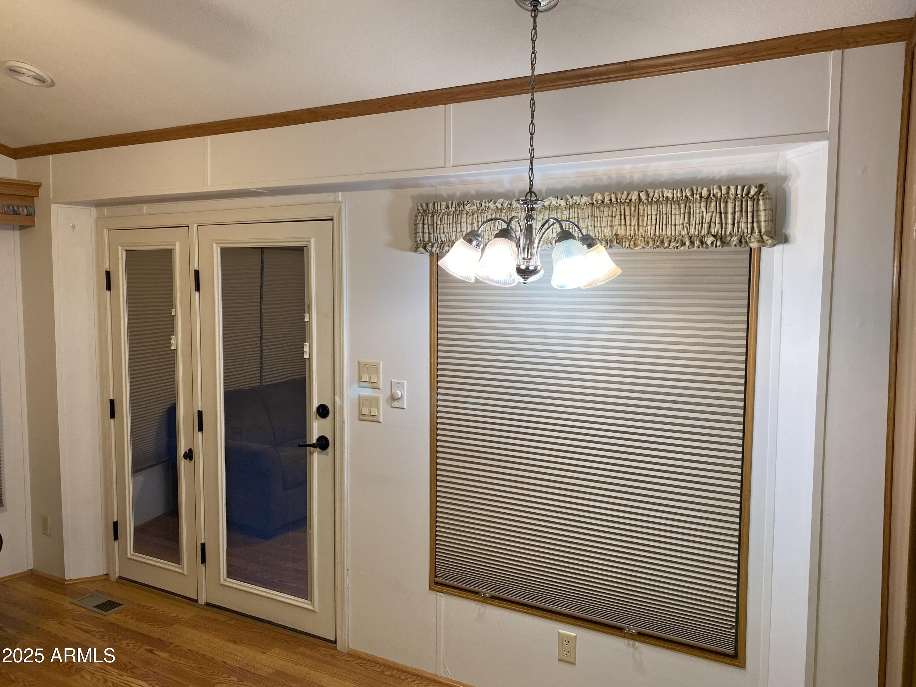 112 Kaolin Drive Apache Junction, AZ 85119 - Photo 10 of 42 a view of a glass door and windows