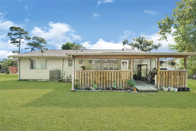a view of outdoor space with playground and green space